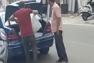Man picks up wheat and cheap ration in a mercedes