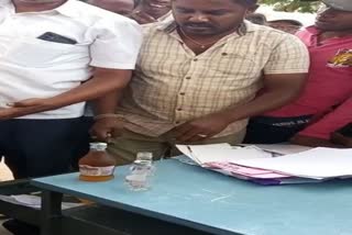 Karnataka Lady teacher caught red handed with liquor bottles at school