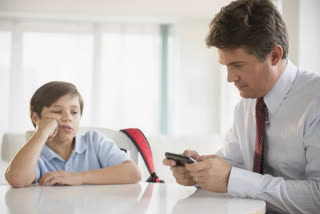 Parents heavily reliant on phones when tending to kids at home