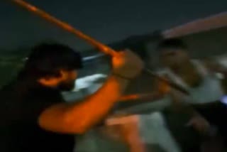 youth thrashed with stick in ghaziabad