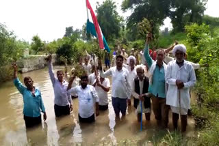 Standing in the river, farmers did water satyagraha