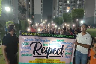Omaxe Society people took out candle march