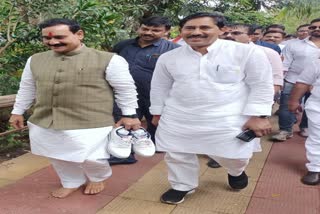 Narottam Mishra picked up the shoes in his hand