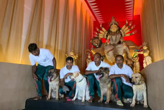 Members of Kolkata police dog squad visit Durga puja pandal in Kolkata