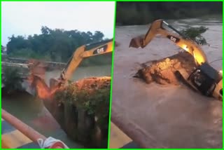 JCB Machine overturned in canal while demolishing bridge in Muzaffarnagar in Uttar Pradesh