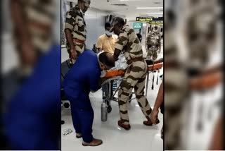 CISF person gives first aid to passenger in chennai airport tamilnadu