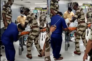 viral-video-cisf-person-gives-first-aid-to-passenger