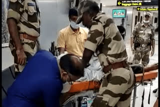 CISF person gives first aid to passenger