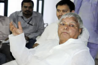 Lalu yadav demands ban on RSS