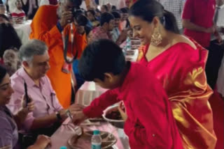 Kajol son Yug serves bhog during Durga Puja, Yug Devgn serves bhog during Durga Puja, Kajal video with son at durga puja