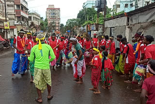 Tribals collecting donations by dancing stick dances for Festival