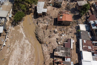 Tales of survival emerge as Venezuela landslide toll hits 34