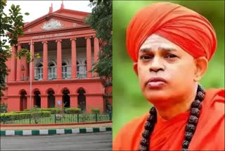 High Court notice to Muruga Sharan  Muruga Sharan over SPA transfer issue  Muruga Sharan pocso case  ಮುರುಘಾ ಶರಣರ ಎಸ್‌ಪಿಎ ವರ್ಗಾವಣೆ ವಿಚಾರ  ವಿಚಾರಣಾ ನ್ಯಾಯಾಲಯಕ್ಕೆ ಸಲ್ಲಿಸಿ ಎಂದು ಹೈಕೋರ್ಟ್ ಸೂಚನೆ  ಚಿತ್ರದುರ್ಗದ ಮುರುಘಾ ರಾಜೇಂದ್ರ ಬೃಹನ್ಮಠ  ವಿಶೇಷ ಪವರ್ ಆಫ್ ಅಟಾರ್ನಿ  ನ್ಯಾಯಾಂಗ ಬಂಧನದಲ್ಲಿರುವ ಶಿವಮೂರ್ತಿ ಮುರುಘಾ ಶರಣ  ಮುರುಘಾ ಶರಣರ ಎಸ್‌ಪಿಎ ವರ್ಗಾವಣೆ  ಅರ್ಜಿದಾರರಿಗೆ ಹೈಕೋರ್ಟ್ ಸೂಚನೆ