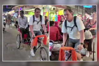 Foreigner rides a rickshaw while rickshaw puller enjoys at the back seat, video viral