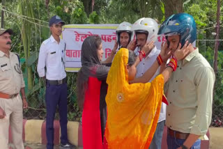 women appeal wife to give husband helmet in mandla