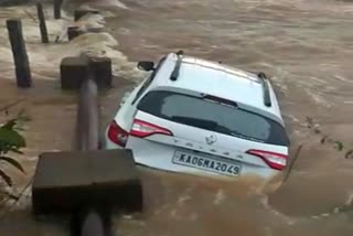 car washed away in water at tumkur