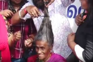 Daya Bai cuts her hair in public as promised after govt meets her demands