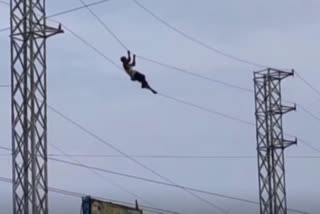 A maniac stunts on electric wires Terrified