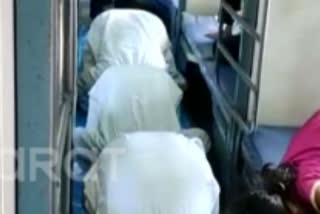 People offering Namaz inside bogie of a train