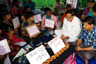 Md Salim spectator as job seekers worship goddess Kali at sit in protest