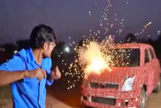 a young man burn his car by bursting firecrackers on it video viral