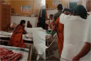 nurse-pushing-female-patient-hair-on-the-bed-in-sitapur-district-hospital