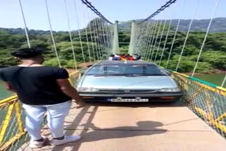 tourists runs car over flyover