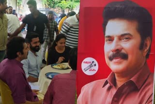 Kaathal location  Kaathal  Suriya visit Mammootty Jyothika movie  Suriya visit  Mammootty Jyothika movie Kaathal  Mammootty  Jyothika  Suriya  ഇടത് സ്വതന്ത്ര്യ സ്ഥാനാര്‍ഥി ആയി മമ്മൂട്ടി  മമ്മൂട്ടി  കാതല്‍ സെറ്റിലെത്തി സൂര്യ  കാതല്‍  സൂര്യ  Suriya in Kaathal location  മമ്മൂട്ടിയുടെ ഫ്ലക്‌സ്‌ ബോര്‍ഡുകള്‍  Jyothika back to Malayalam cinema  Jeo Baby directed by Kaathal