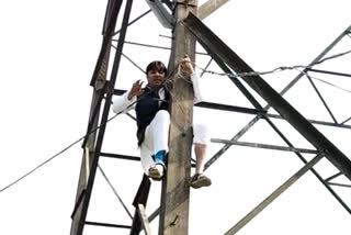 AAP leader climbs atop transmission tower in protest