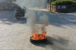 road blocked by burning tyres in lakhimpur
