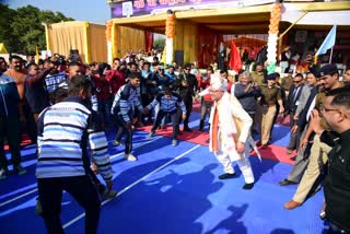 CM Dhami playing Kabaddi with players