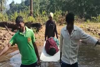 pregnant woman carried in cot due to no road in kalahandi