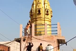 two People Climbed atop Temple in kaman