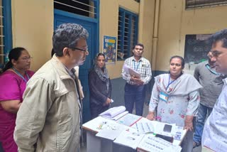 BBMP Chief Commissioner checking the voter list