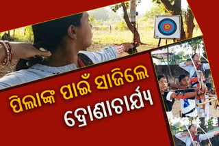 mother giving archery training to his child in sambalpur