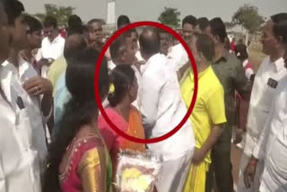 TRS MLA Krishna M Reddy seen holding collar