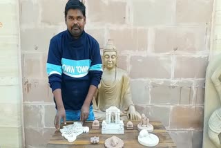 man Carving idols on rocks