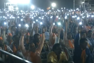 Crowd turn on flashlights of mobile phones during Prime Minister Narendra Modis speech in Jamnagar