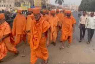 Troupe of Saints laden in saffron cast vote in Vadodara
