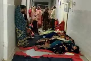 Women lie on ground in bitter cold