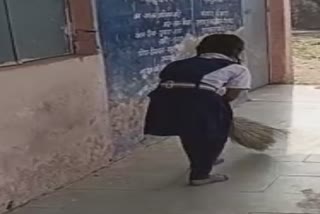 sehore student sweeping in school