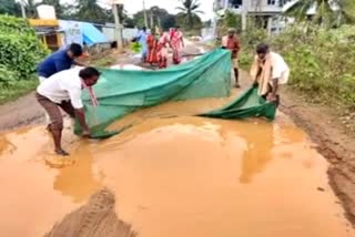 villagers protest throwing nets catch fish on potholed road