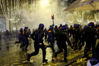 French Police Use Tear Gas Against Fans on Champs-Elysees in Paris