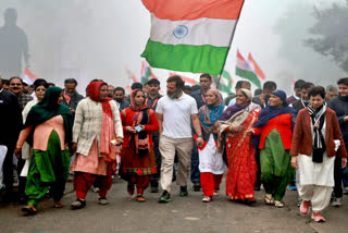 Rahul Gandhi walking with women during the Bharat Jodo Yatra recently