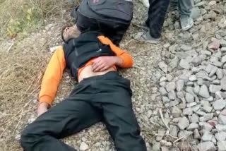 young man lay down in front of Rajdhani Express