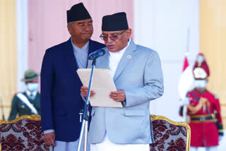 Nepal's former prime minister Sher Bahadur Deuba, left, reacts as newly elected prime minister Pushpa Kamal Dahal, right, takes oath during a ceremony at the President House in in Kathmandu, Nepal, Monday, Dec. 26, 2022.