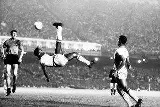 Brazil's soccer star Pele bicycle kicks a ball during a game at unknown location, Sept. 1968.