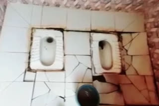 Two toilet seats in one enclosure in Basti