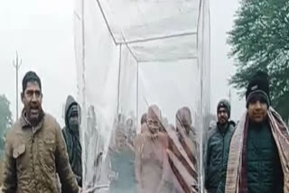 Digambar Jain sect marches unclad amid severe cold with just plastic shield around