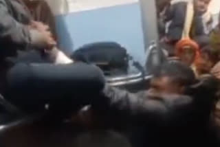 Railway official seen thrashing passenger after a dispute over ticket